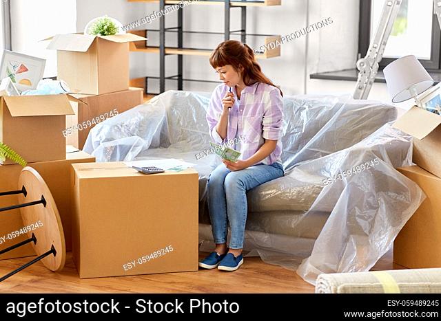 asian woman moving to new home and counting money