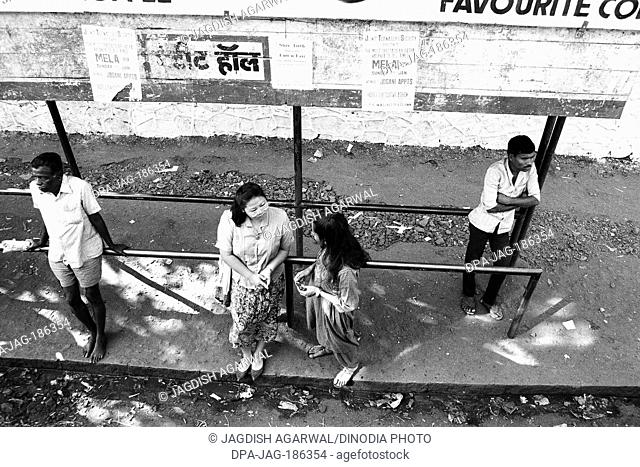 Men and women waiting at Petit Hall bus stop Mumbai Maharashtra India Asia 1989