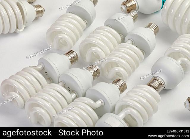 Many fluorescent lightbulbs in a pile