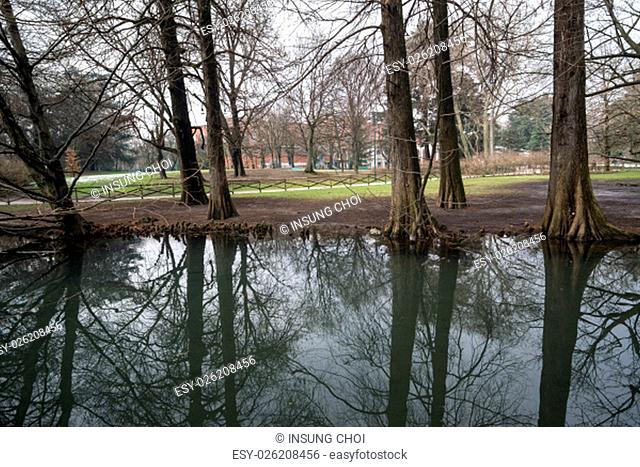 Park sempione lake reflection scene in Milan, Italy