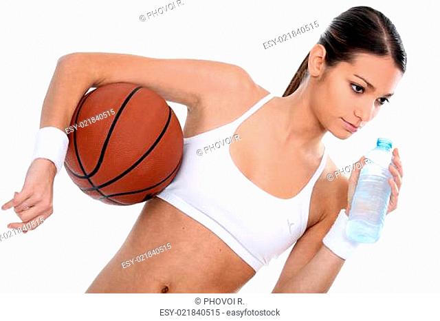 Woman holding basketball and bottle of water