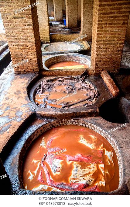 Tannery in the middle of souk in Fez, Morocco. Traditional leather tannery from the 11th century is now biggest tourits attraction in Fes