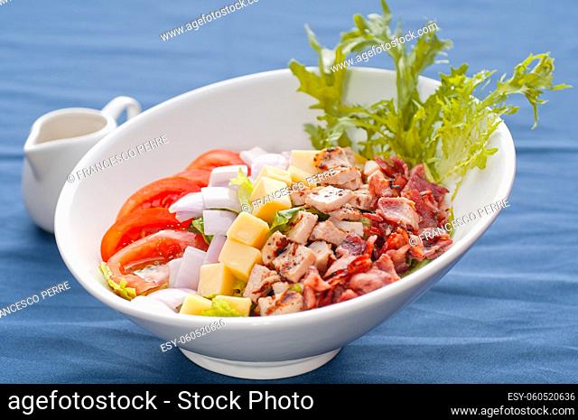 fresh classic caesar salad over blue tablecloth close up, healthy meal , MORE DELICIOUS FOOD ON PORTFOLIO