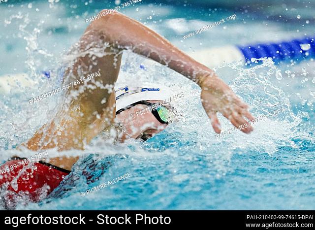 03 April 2021, Baden-Wuerttemberg, Heidelberg: Jessica Felsner swims in the preliminary heat of the 100-meter freestyle during an Olympic qualifying competition...
