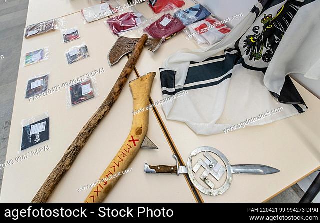 21 April 2022, Baden-Wuerttemberg, Heilbronn: A bayonet with an embedded swastika and two axes, brand self-made, which were seized during a police operation in...