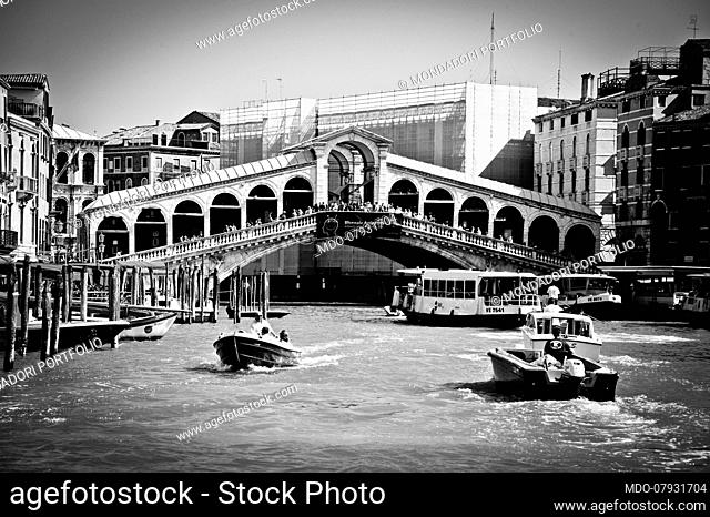 The typical boats of Venice, the gondolas in Rialto bridge. Venice (italy), September 11th, 2016