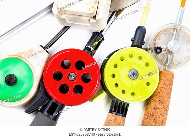 closeup ice-fishing rods, tackles and equipment on white background
