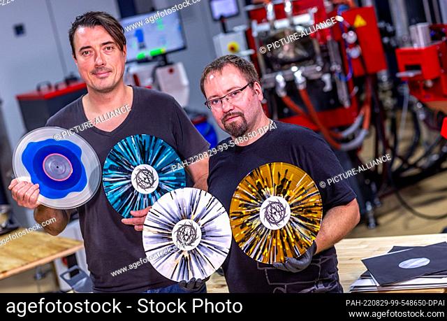 22 August 2022, Mecklenburg-Western Pomerania, Güstrow: Andre Kronert (l), and Daniel Slabschie (r), the managing directors of the record company ""Matter of...