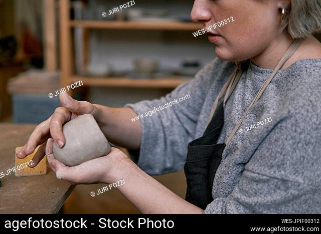 Close-up of potter working on workpiece