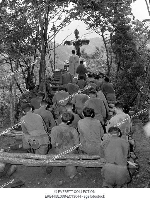 Chaplain conducts services north of Hwachon, Korea, for men of 31st Regiment. August 28, 1951. Korean War, 1950-53. (BSLOC-2014-11-157)