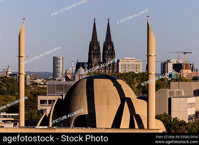 06 October 2022, North Rhine-Westphalia, Cologne: The central mosque of the DITIB (Turkish-Islamic Union of the Institute for Religion) and Cologne Cathedral...