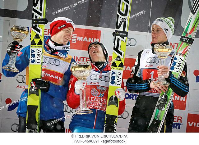 The ski jumpers Stefan Kraft (C, first place), Michael Hayboeck (L, second place, both Austria), and Peter Prevc (R, third place