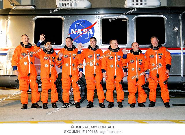 After suiting up, the STS-123 crewmembers pause alongside the Astrovan to wave farewell to onlookers before heading for launch pad 39A for the launch of Space...