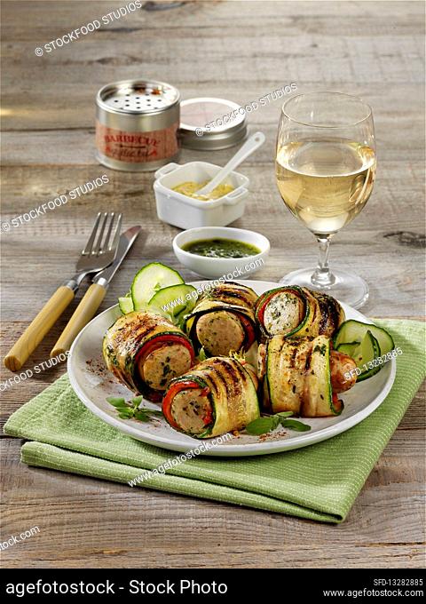Grilled sausages wrapped in zucchini