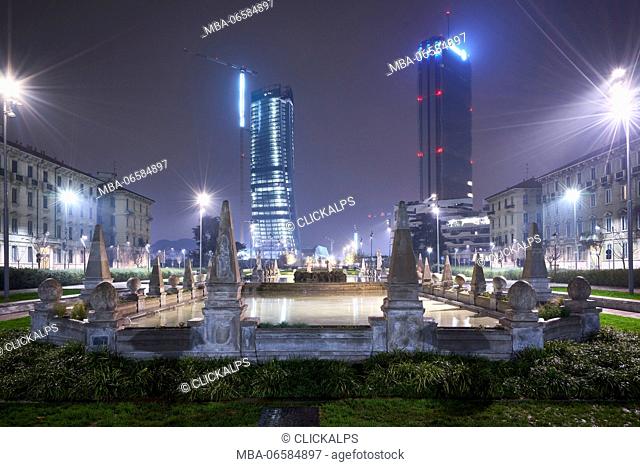 Milan, Lombardy, Italy, Citylife neighborhood with Fontana delle Quattro Stagioni by night