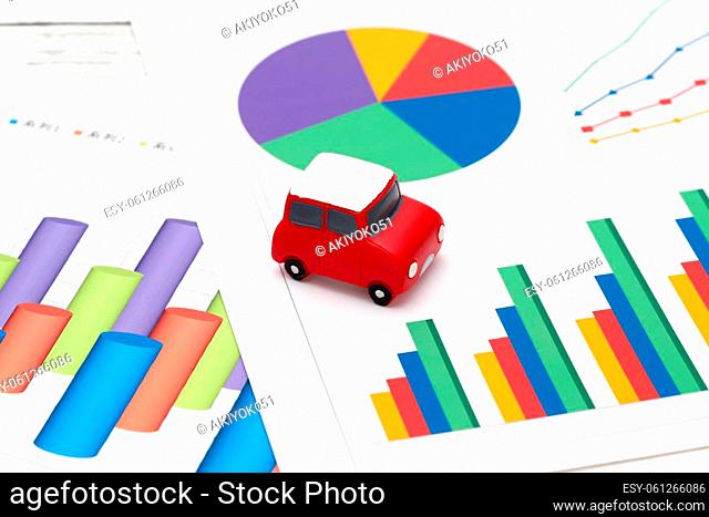 toy car and color chart printed documents on the table