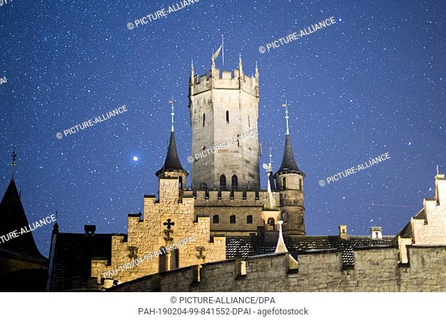 04 February 2019, Lower Saxony, Pattensen: The starry sky above Marienburg Castle in the Hanover region shines brightly (long-term exposure)