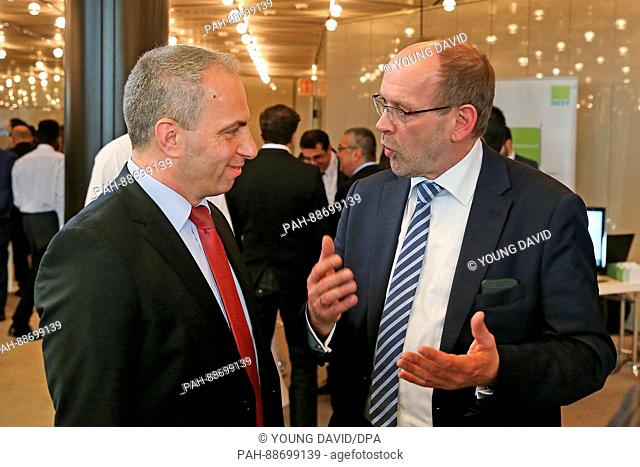 Rainer Schmeltzer (SPD), Minister for Labour, Integration and Welfare of German federal state North Rhine-Westphalia talking to the chairman of Turkish business...
