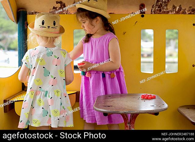 Girls playing together in playhouse