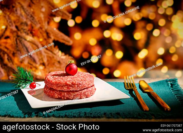 Abstract Beef Raw Minced Homemade Meat with Red Christmas Ball onTop