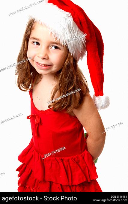 Little girl wearing a red dress and a red santa hat