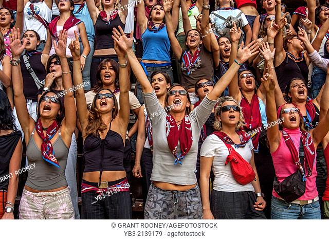 Young Women From The Tower Contrada Cheer On Their Horse and jockey, The Palio, Siena, Tuscany, Italy