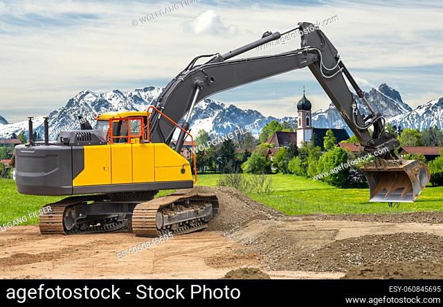 heavy earth mover bulldozer working on construction site