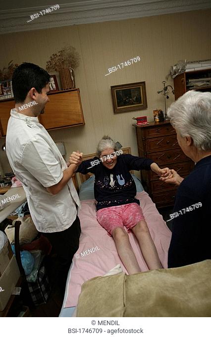 Photo essay. Home visit of a kinesitherapist to see a person affected by multiple sclerosis