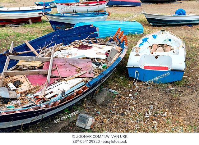 Old Wrecks of fishing sloop on Sicilian beach