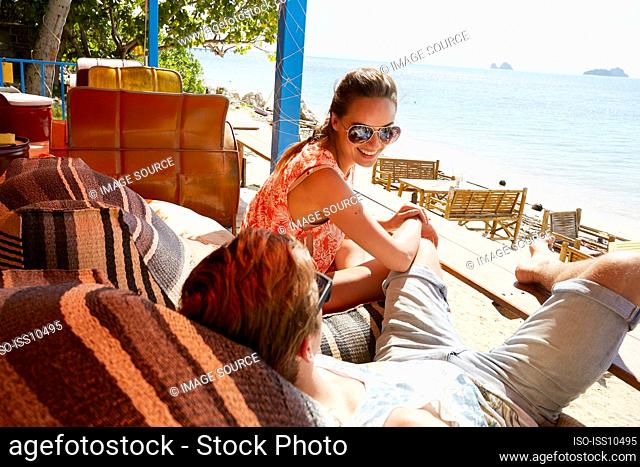 Young couple relaxing beside beach in Ko Samui, Thailand