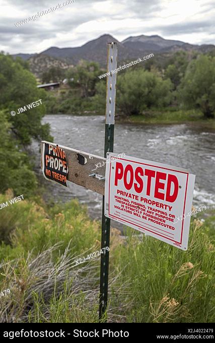 Salida, Colorado - Signs on the banks of the Arkansas River forbid fishing and other activities along or in the river. Private landowners along the Arkansas and...
