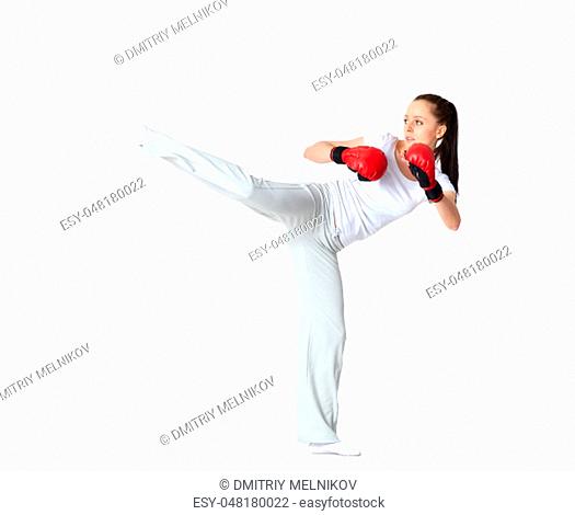 Sporty young woman in red fighting gloves on a white background