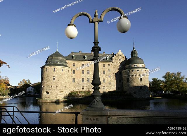 An old street lamp in front of the castle in Örebro on a beautiful autumn day