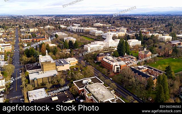 The state capital building adorned with the Oregon Pioneer with Willamette University grounds visable