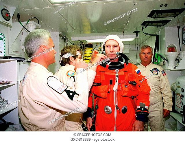 04/29/1999 --- In the white room, an environmental chamber, at Launch Pad 39B, STS-96 Mission Specialist Valery Ivanovich Tokarev, with the Russian Space Agency