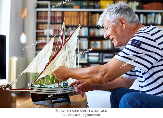 Senior man, 60-70, Building model sailboat, Whaleship, Getaria, Gipuzkoa, Basque Country, Spain, Europe