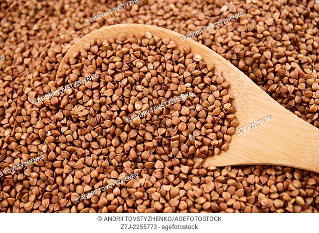 buckwheat in wooden spoon