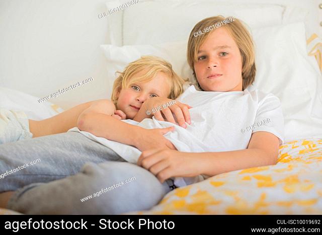 Brothers resting in bed