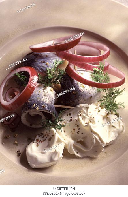 Rolled pickled herrings with cream
