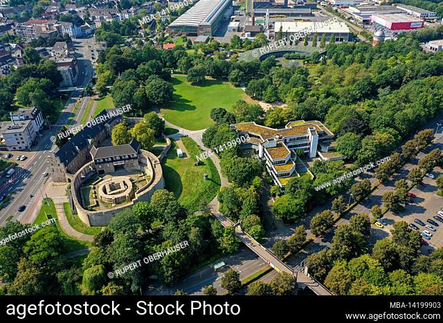 Muelheim an der Ruhr, Ruhr area, North Rhine-Westphalia, Germany - MueGa park with Broich Castle, the building of the adult education center (VHS) and in the...