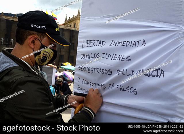 A demonstrator writes a message in protest of young protesters arrested illegaly by police during demonstrations called by work unions against the government of...
