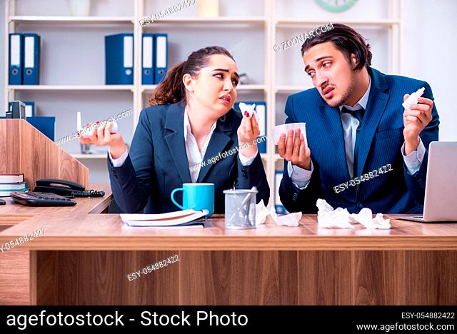 Two employees suffering at workplace