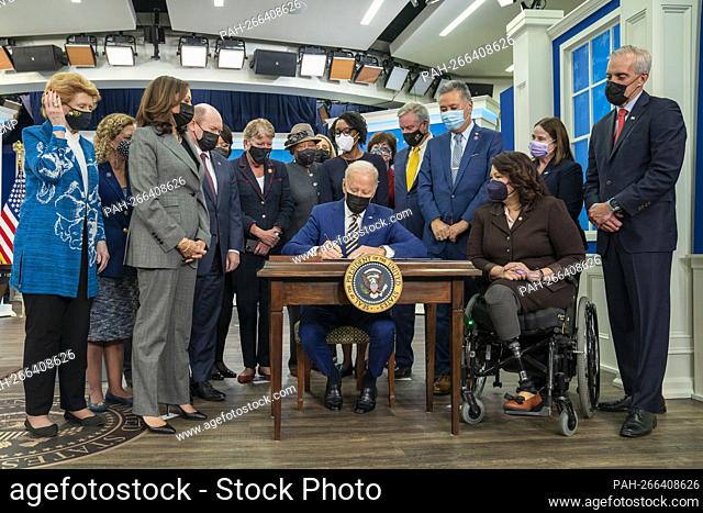 President Joe Biden signs S. 796: Protecting Moms Who Served Act of 2021, in the South Court Auditorium of the Eisenhower Executive Office Building of the White...