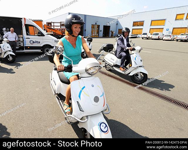 12 August 2020, Thuringia, Jena: Susanna Karawanskij, State Secretary for Infrastructure in Thuringia, rides an electric scooter, a rented vehicle