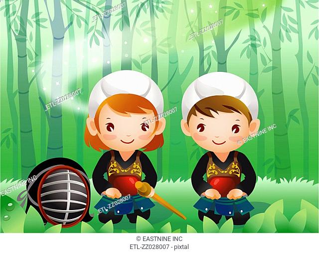 Portrait of a boy and a girl wearing kendo uniform sitting in the forest