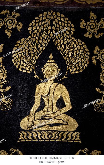 Theravada Buddhism, ancient gold Buddha mural, meditation, bhumisparsha mudra, bhumisparshamudra gesture of calling the earth, in the temple of Wat Xieng Thong
