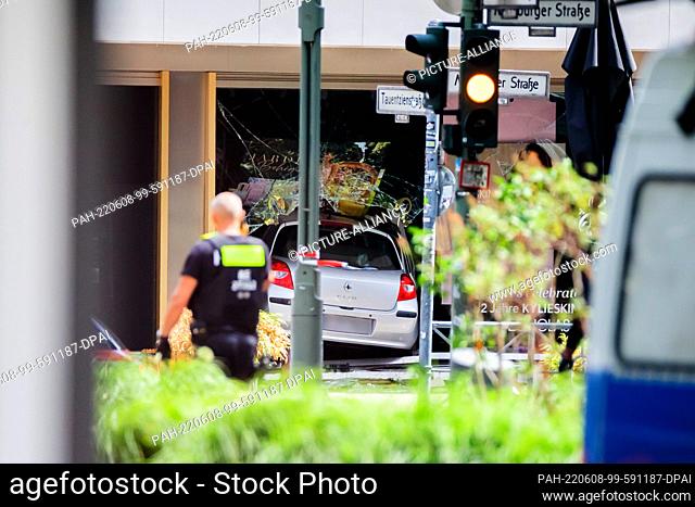 08 June 2022, Berlin: A car is in the window of a store on Tauentzienstrasse after it crashed into a group of people. One person died in the deadly incident