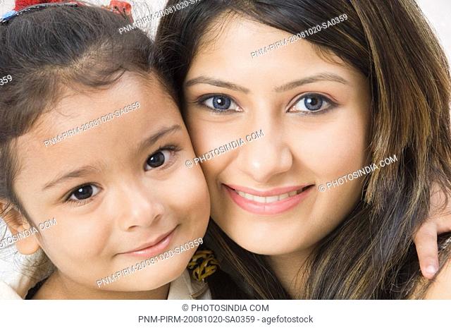 Woman smiling with her daughter