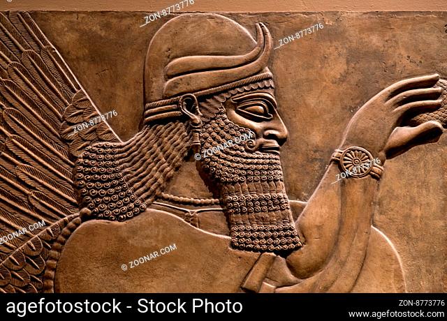 Ancient relief of an assyrian god