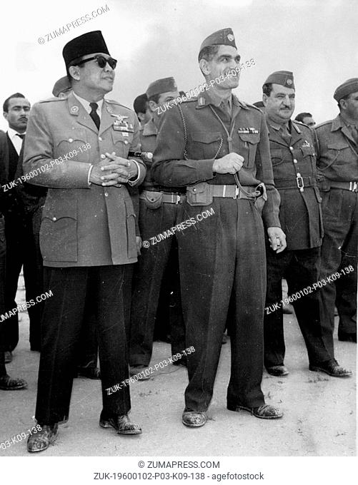 Dec. 21, 1976 - Two Men with Peace or War on their minds this weekend: Seaed together in an Army College in Irak are two dictators of this troublous age